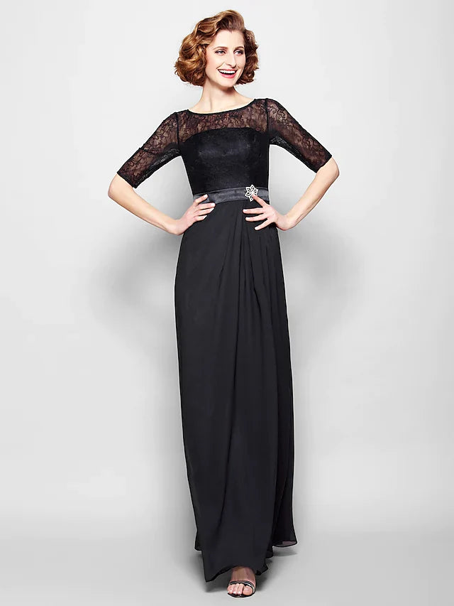 Woman in an elegant A-line mother of the bride dress with jewel neck and half sleeves.
