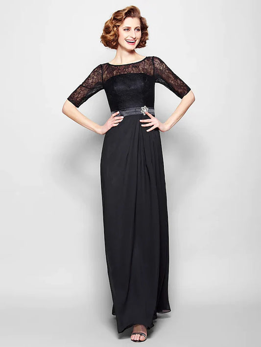Woman in an elegant A-line mother of the bride dress with jewel neck and half sleeves.