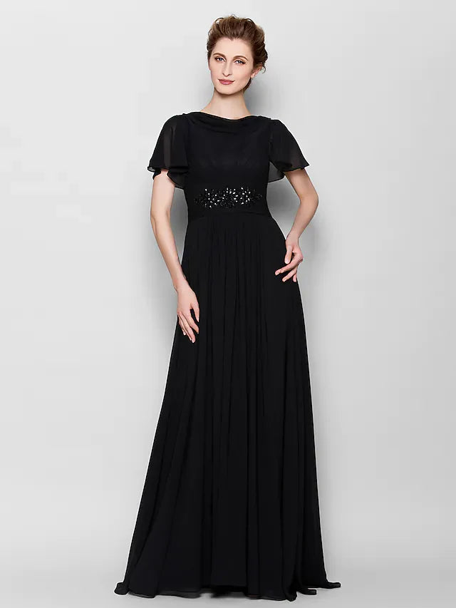 Close-up of the beaded bateau neckline and short sleeves on the chiffon dress.