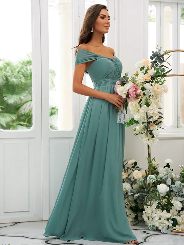 A woman wearing an elegant A-line off-the-shoulder floor-length bridesmaid dress.