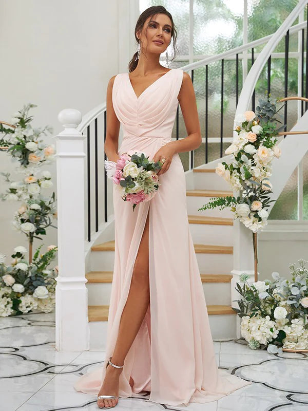 Woman wearing an A-line chiffon bridesmaid dress with a ruched V-neck.