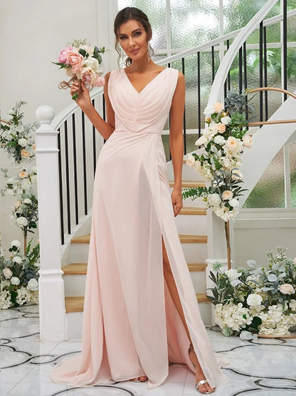 Side view of a woman in a flowing A-line chiffon bridesmaid gown.