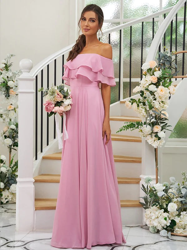 Close-up of the ruffled off-the-shoulder detail on the chiffon dress.