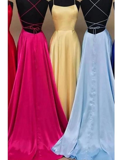 Model posing in the elegant A-line charmeuse gown, highlighting the backless detail and flowing skirt.