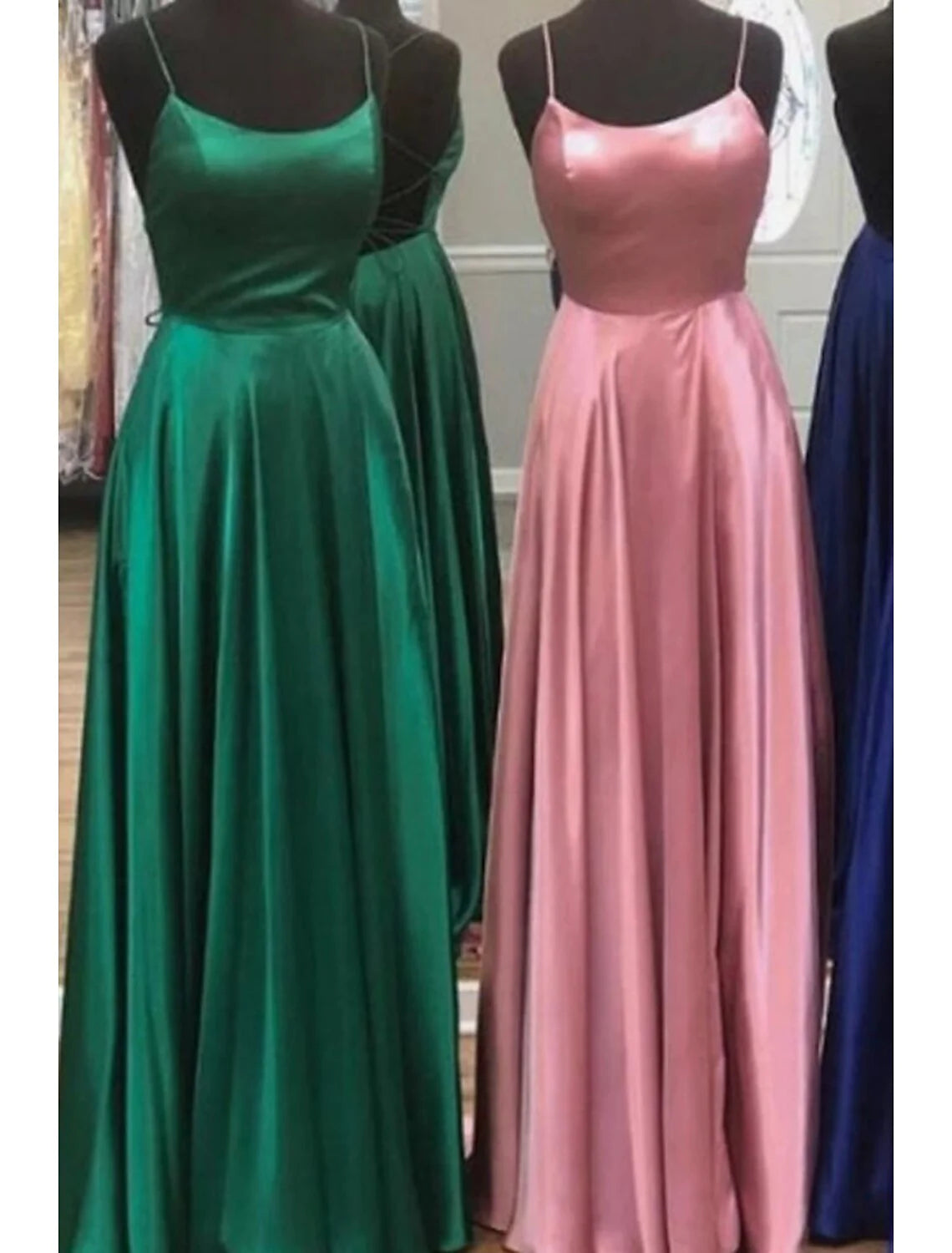 Close-up of the A-line formal dress, focusing on the spaghetti straps, empire waist, and fabric texture.