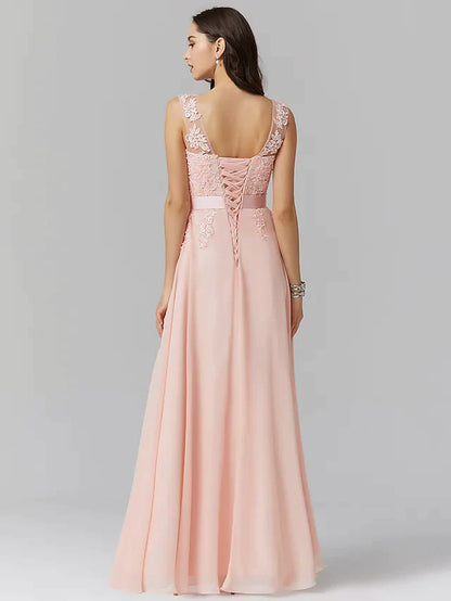 Back view of A-line empire formal evening dress featuring illusion neckline and lace details.