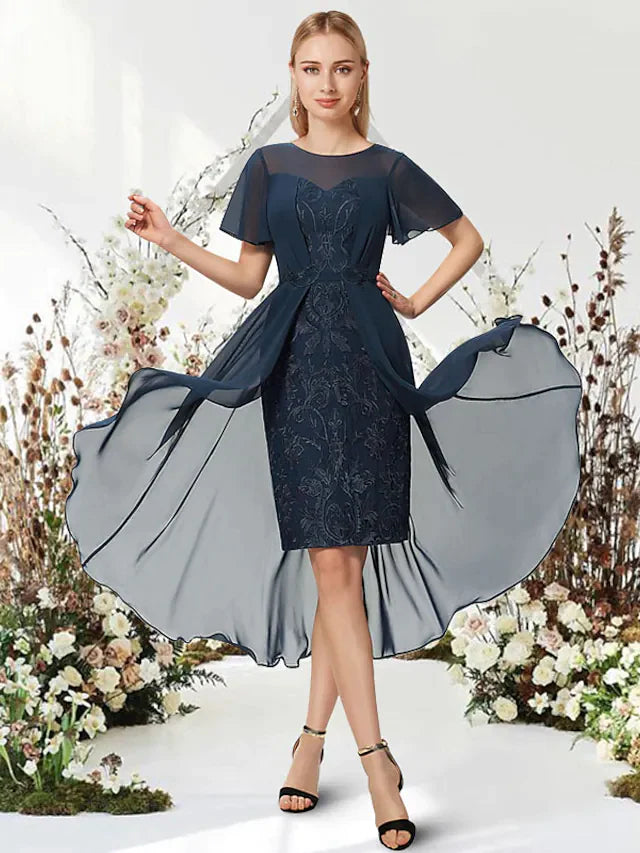 Model wearing an elegant A-Line Empire chiffon dress with short sleeves and an asymmetrical knee-length hem.