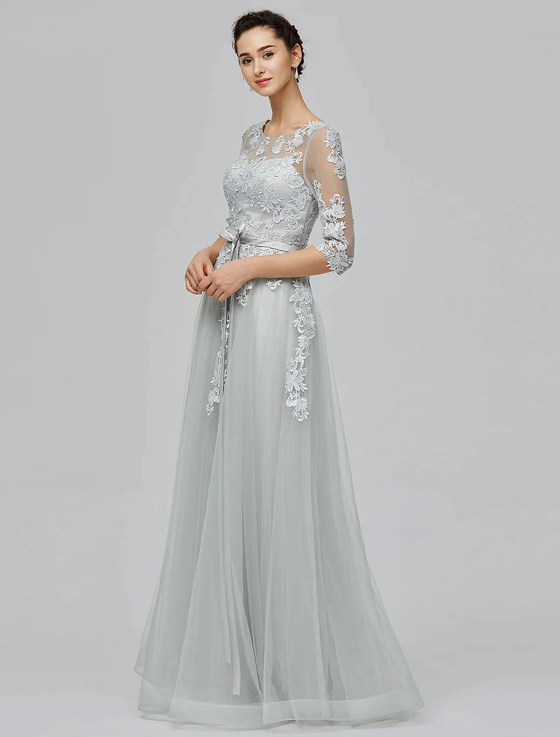 Close-up of the illusion neckline and half sleeves of the A-Line Empire tulle dress.