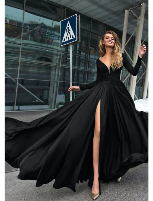 Woman wearing a pure color A-line empire long sleeve V-neck evening gown.
