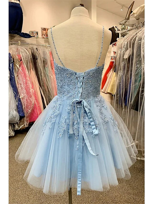 Back view of the A-Line floral mini dress with tulle skirt and delicate appliques.