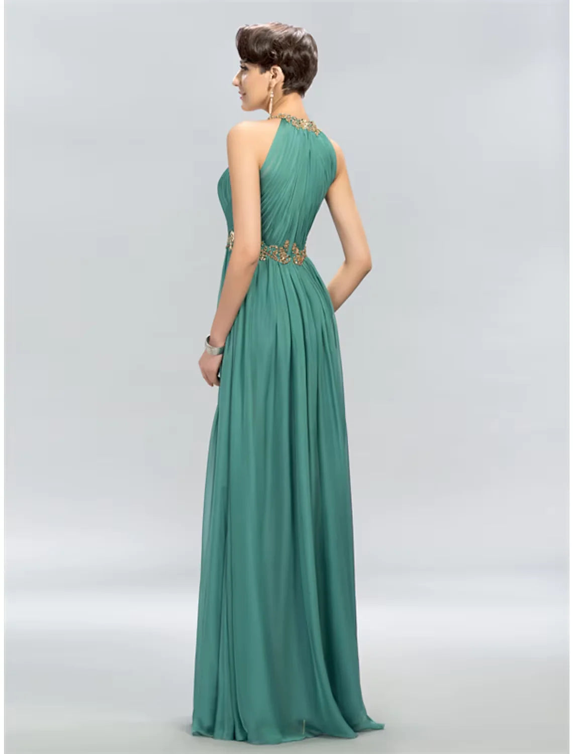 Side view of the A-line halter chiffon maxi dress, highlighting the ruched details.