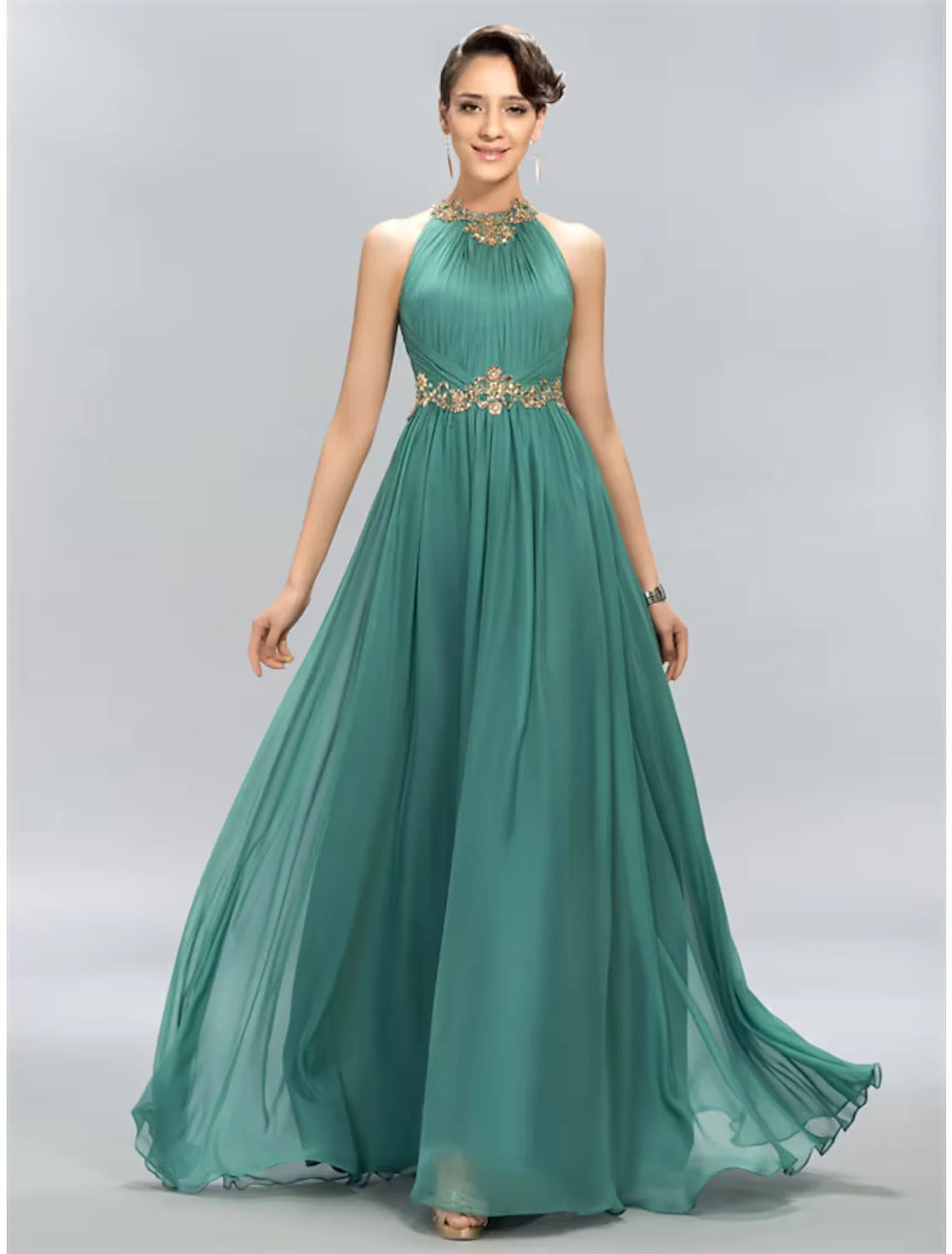 Back view of the floor-length A-line halter dress, showing the flowing chiffon fabric.