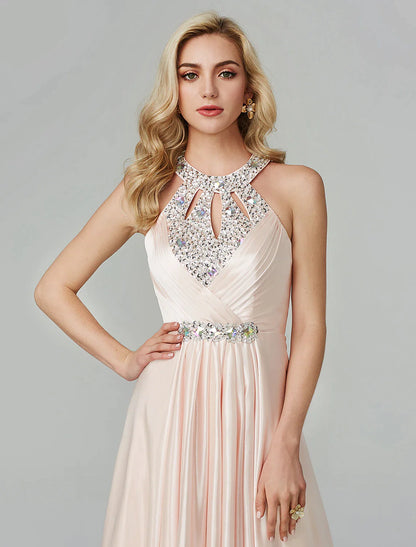 Model posing in a black A-line halter neck sequin dress.