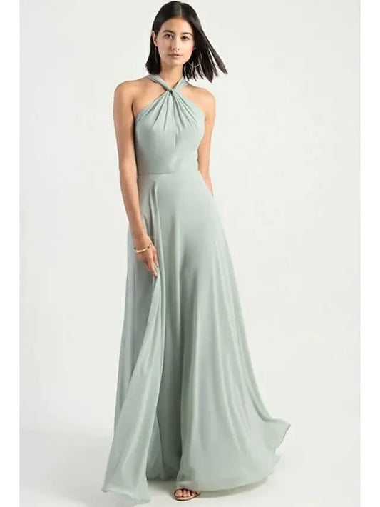Model wearing a blue A-line halter neck chiffon bridesmaid dress with criss-cross back.