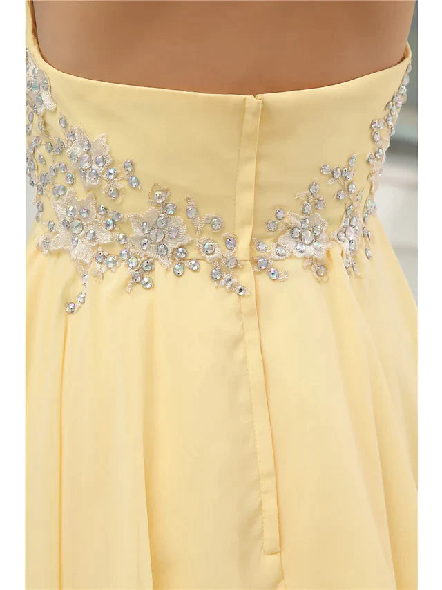 Close-up of the intricate beading and tiered chiffon fabric on the mini dress.
