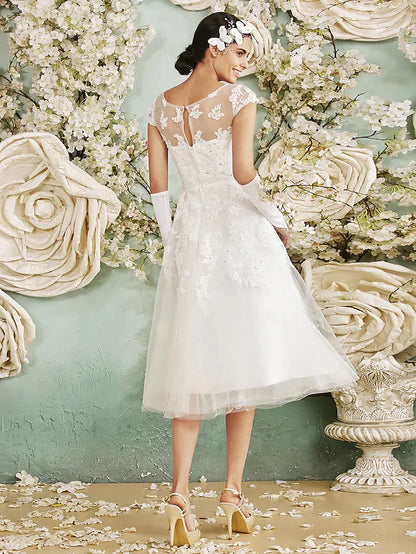Back view of A-line wedding dress showing sequin criss-cross detail.