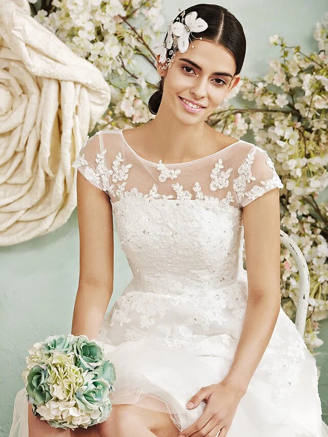 Model posing gracefully in the A-line halter neck wedding dress.