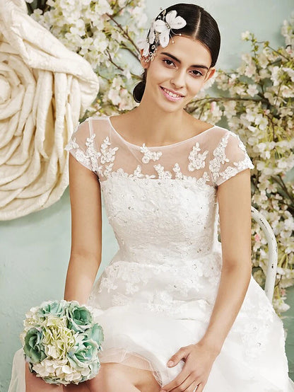 Model posing gracefully in the A-line halter neck wedding dress.