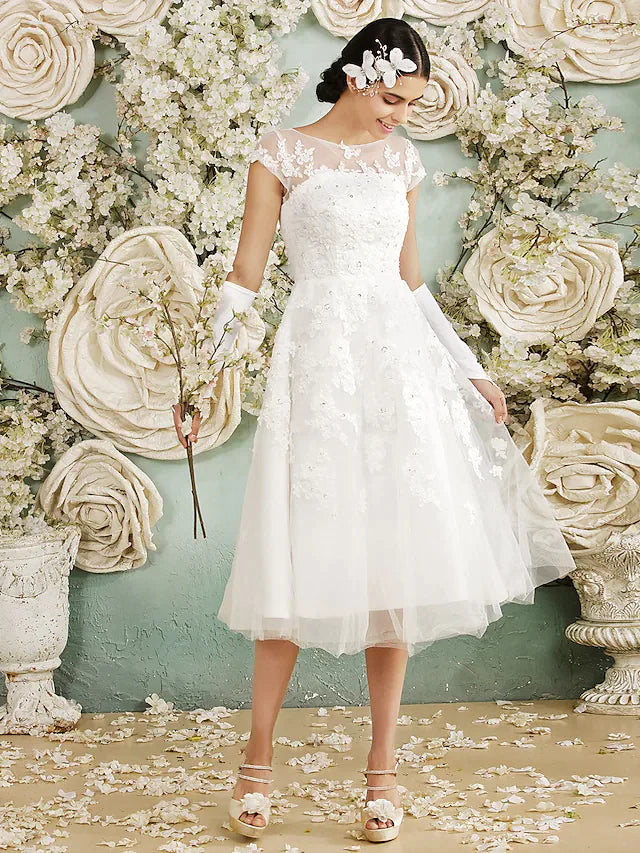 Bride standing in the elegant A-line wedding dress.