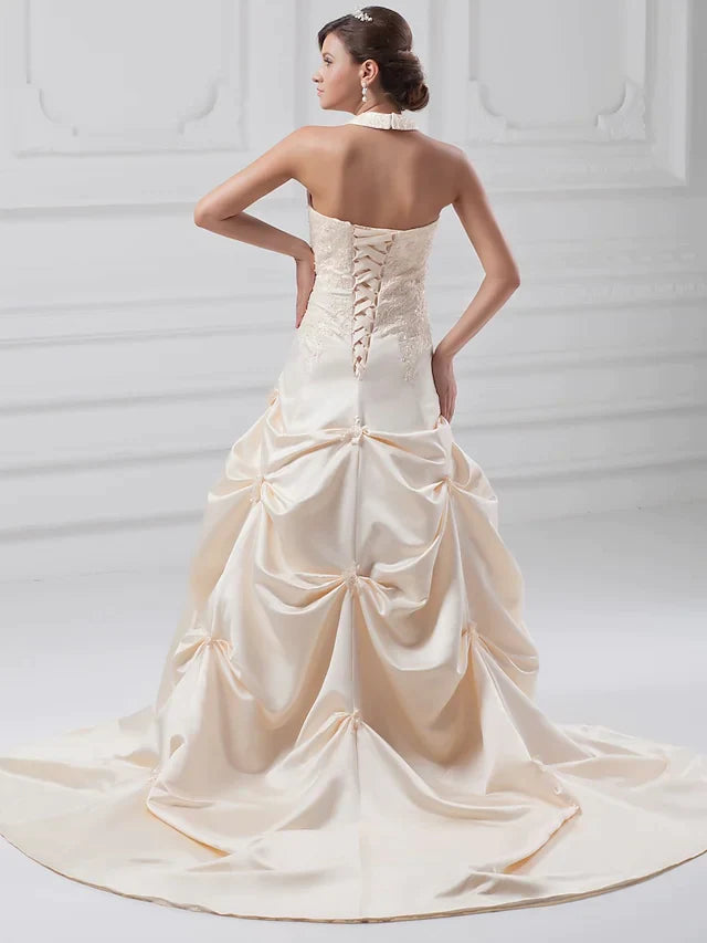 Side view of A-Line wedding dress showing pick-up skirt and train.