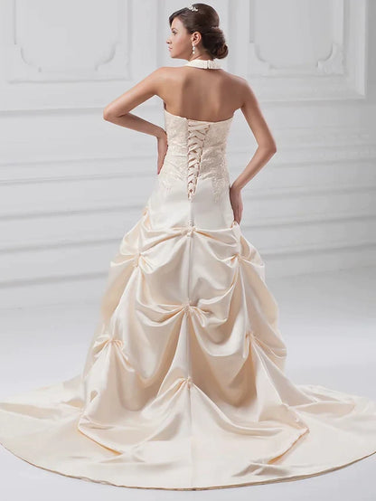 Side view of A-Line wedding dress showing pick-up skirt and train.