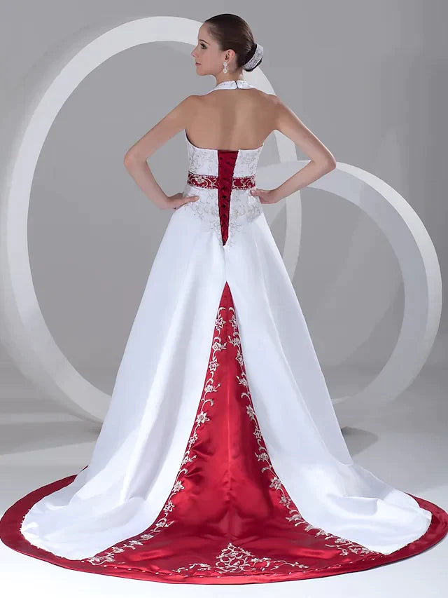Close-up of the halter neck and bodice of the A-line wedding dress, highlighting intricate beading and embroidery details.