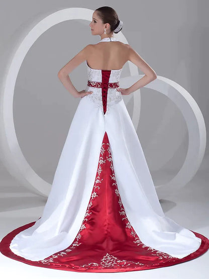 Close-up of the halter neck and bodice of the A-line wedding dress, highlighting intricate beading and embroidery details.