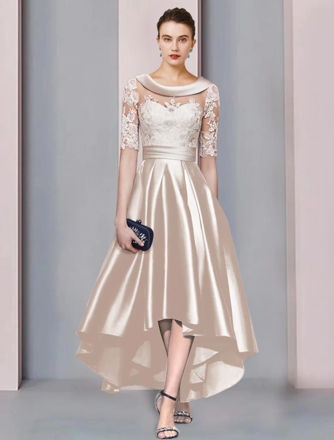 Elegant A-line high-low tea length mother of the bride dress with scoop neck and half sleeves, featuring lace appliques.