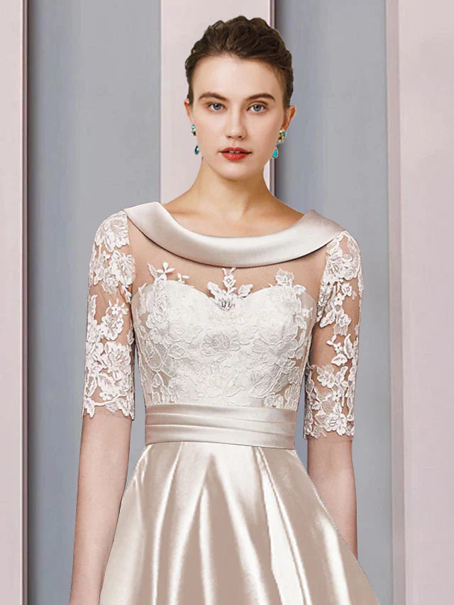 Side view of the elegant A-line high-low tea length mother of the bride dress, showcasing the asymmetrical hemline and satin.