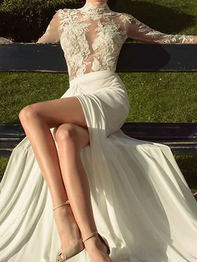 Close-up of high neck and delicate lace illusion sleeves on the wedding dress.