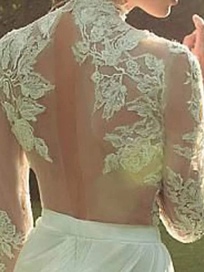 Back view of wedding dress, highlighting court train and lace appliques.