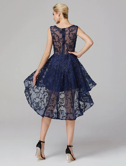 Side view of a model in a multi-color A-line illusion neck asymmetrical dress.