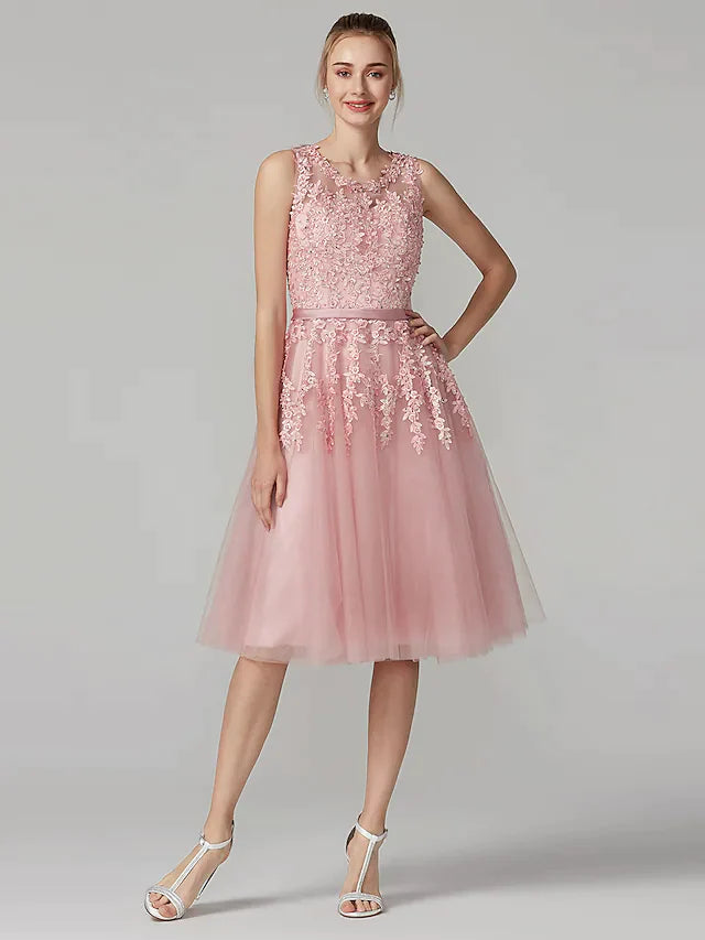 Model wearing an elegant A-line floral beaded cocktail dress, front view.