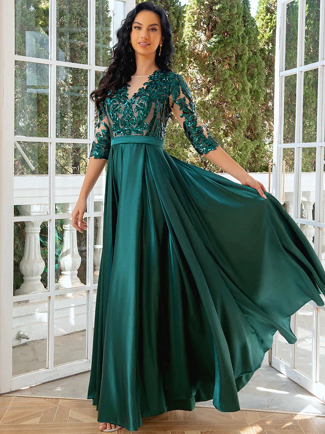 Close-up of illusion neck and half sleeves with sequin detail.