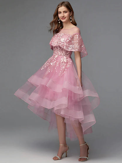 Close-up of the illusion neckline and lace bodice on the dark dress.