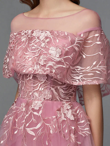 Side view of the dark high-low cocktail dress, highlighting the silhouette.