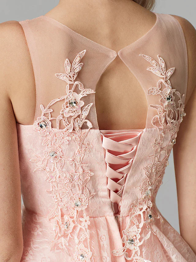 Back view of the pink A-line mini dress, showcasing the flowing tulle skirt.