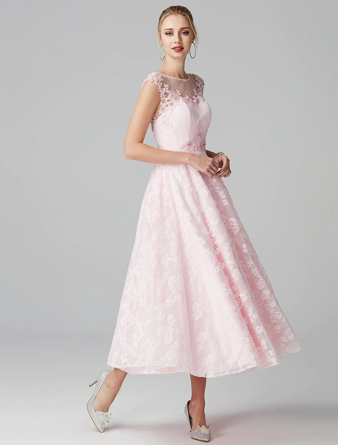 Full view of the navy blue A-line floral lace dress, highlighting the flowing skirt.