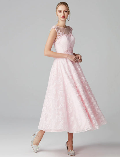 Full view of the navy blue A-line floral lace dress, highlighting the flowing skirt.