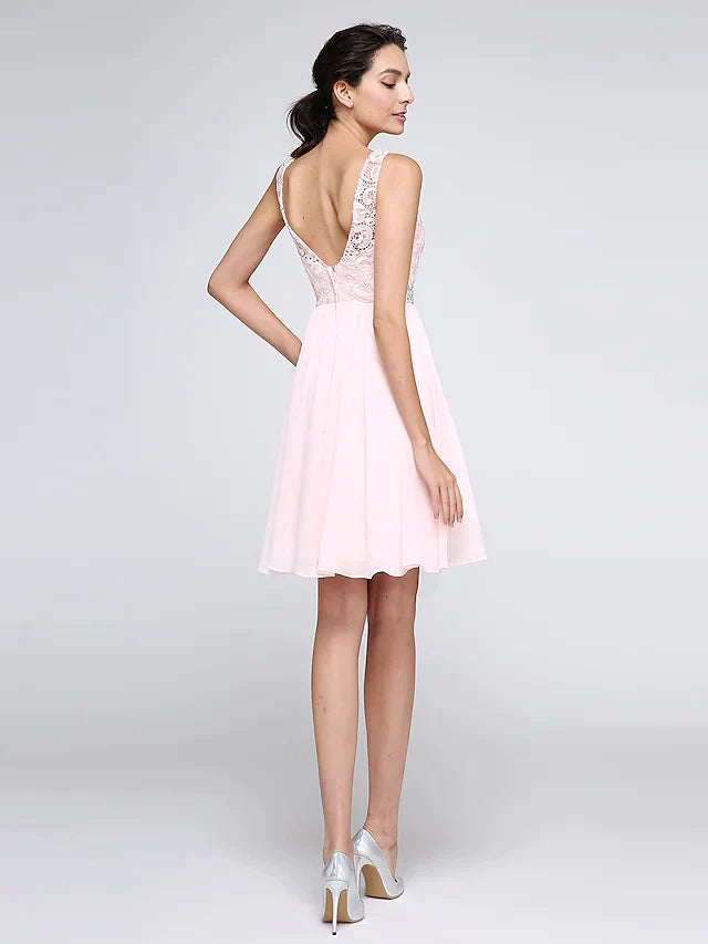 Back view of the A-line sleeveless mini dress with intricate lace and crystal embellishments.