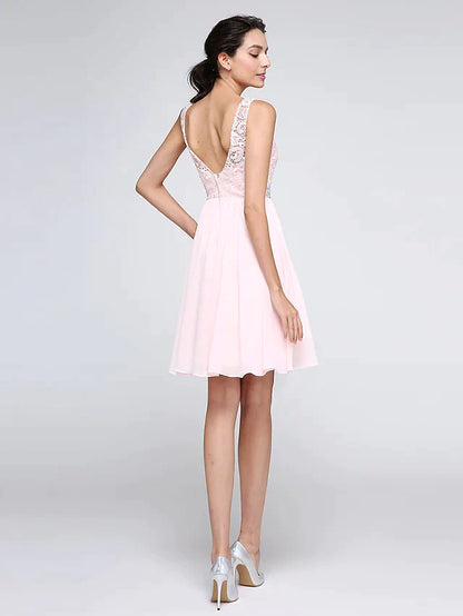 Back view of the A-line sleeveless mini dress with intricate lace and crystal embellishments.