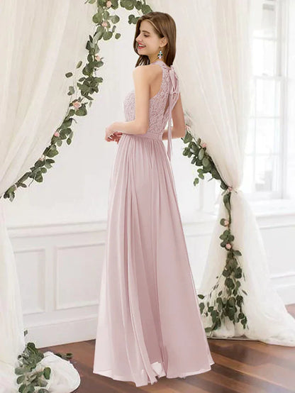 Floor length A-Line bridesmaid gown featuring a jewel neck and pleated chiffon.