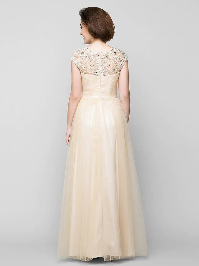 Back view of A-Line tulle gown with criss-cross beading.