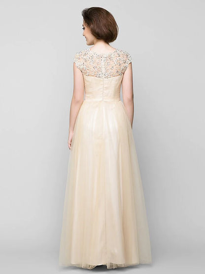 Back view of A-Line tulle gown with criss-cross beading.
