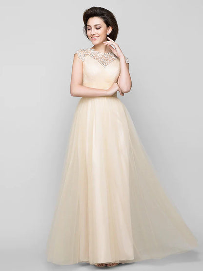 Side profile of woman wearing floor-length beaded Mother of the Bride dress.