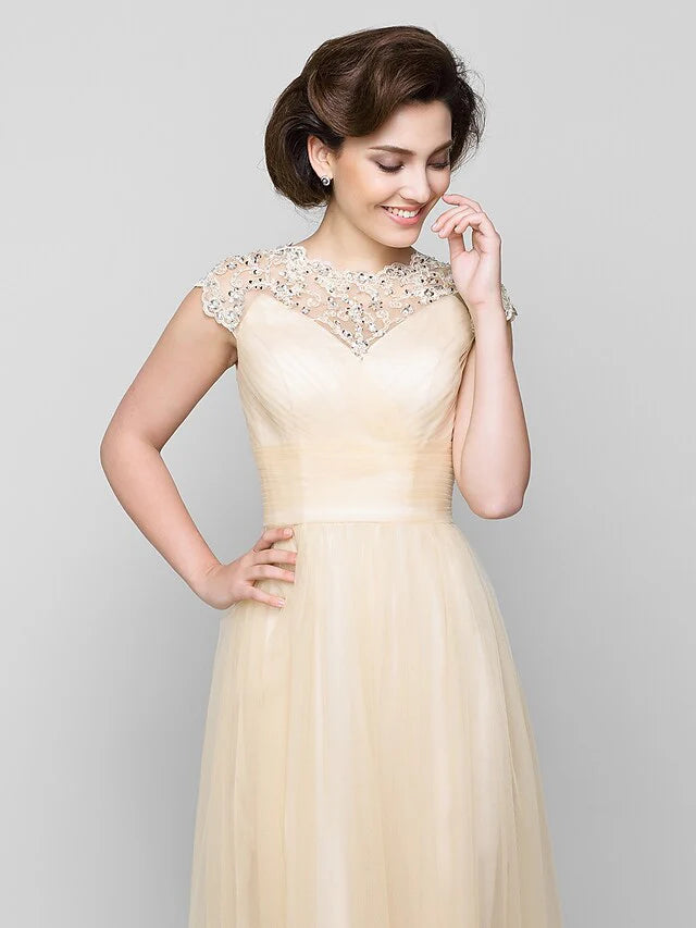 Close-up of jewel neck and intricate beading on A-Line dress.