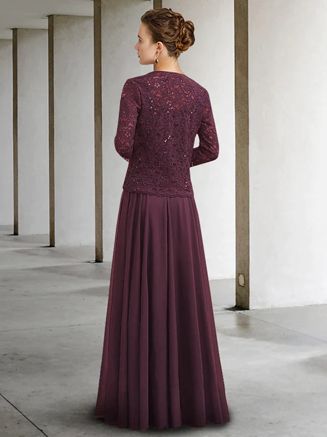 Side view of a woman wearing a blue two-piece A-Line Mother of the Bride dress, highlighting the flowing skirt and half.