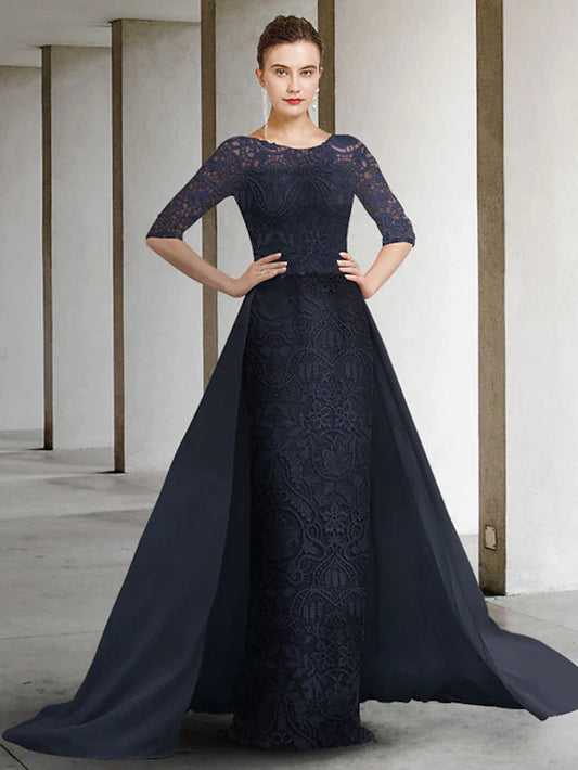 Woman in elegant A-line mother of the bride dress with jewel neck, lace bodice, half sleeves, and pleated chiffon skirt.