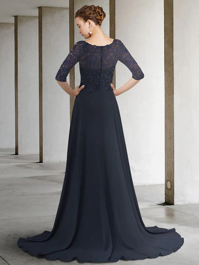 Side view of woman in A-line mother of the bride dress, showing flowing chiffon skirt and half sleeves.