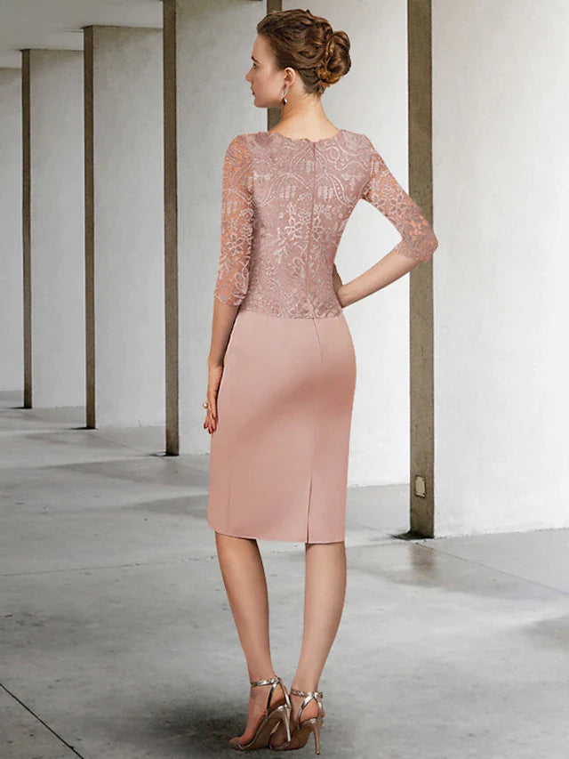 Woman wearing a half-sleeve lace Mother of the Bride dress, showing side profile and back detail.